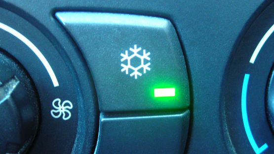 The air conditioning button in a car.
