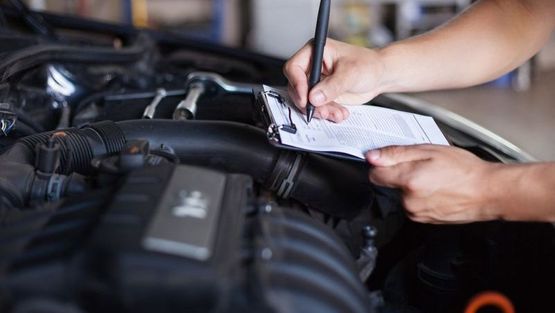 A mechanic using our diagnostic machine