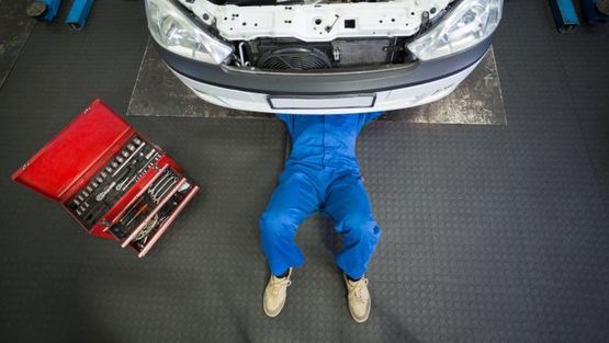 Our mechanic servicing a car.