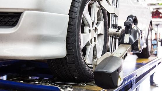 One of our mechanics aligning new tyres.